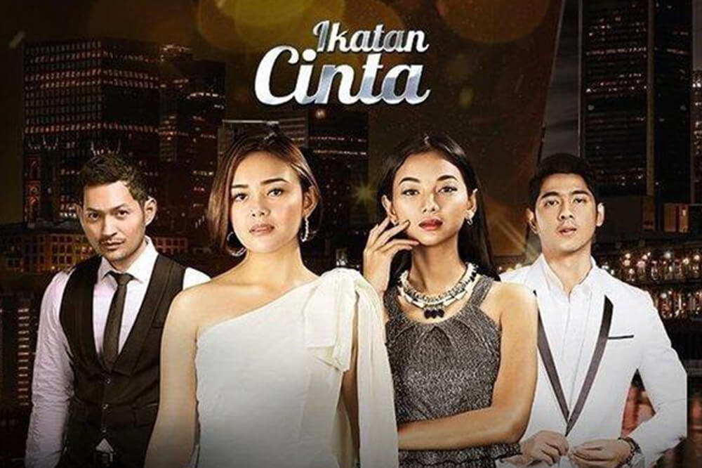 ikatan cinta features two couples in elegant attire with a city skyline in the background.